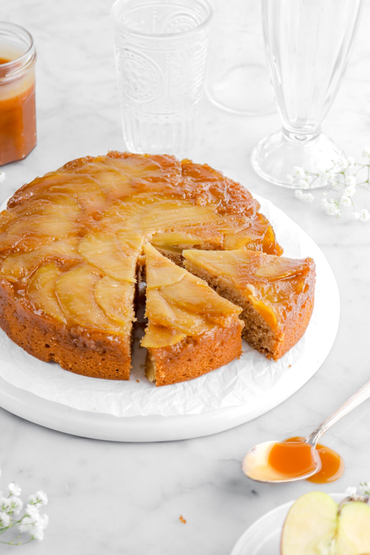 cropped close up of two slices cut into caramel apple upside down cake.