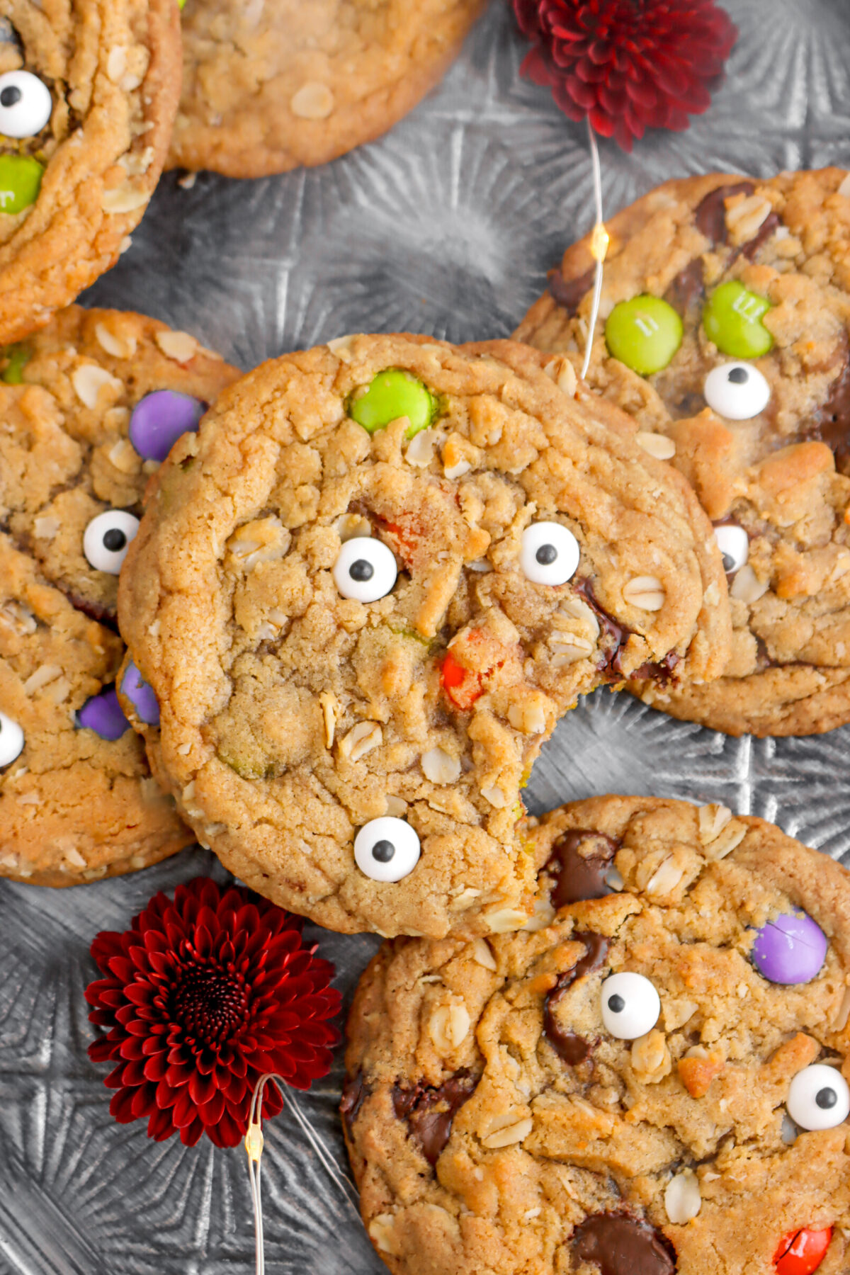overhead close up of monster cookie wit bite missing.