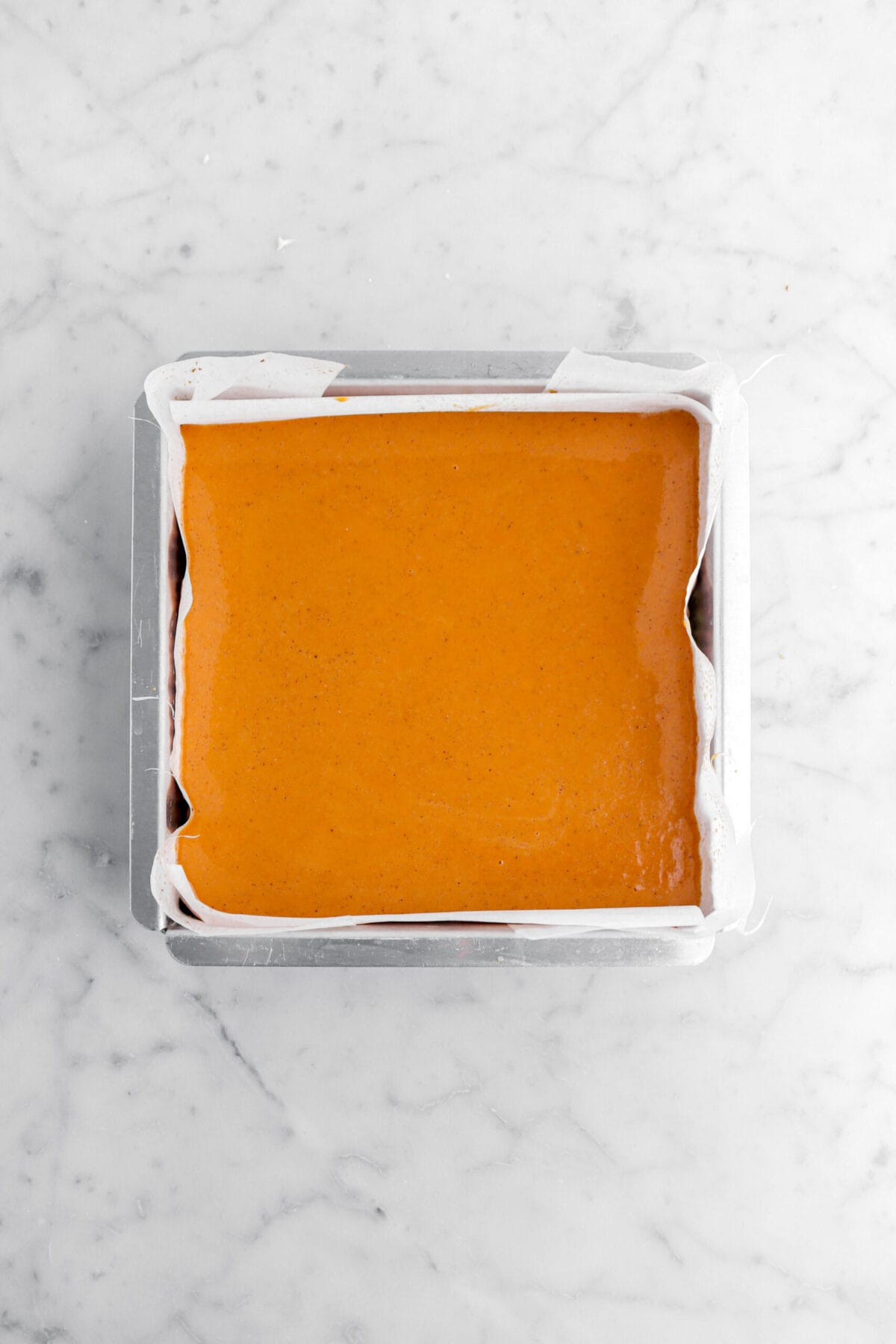 pumpkin pie in square lined cake pan.