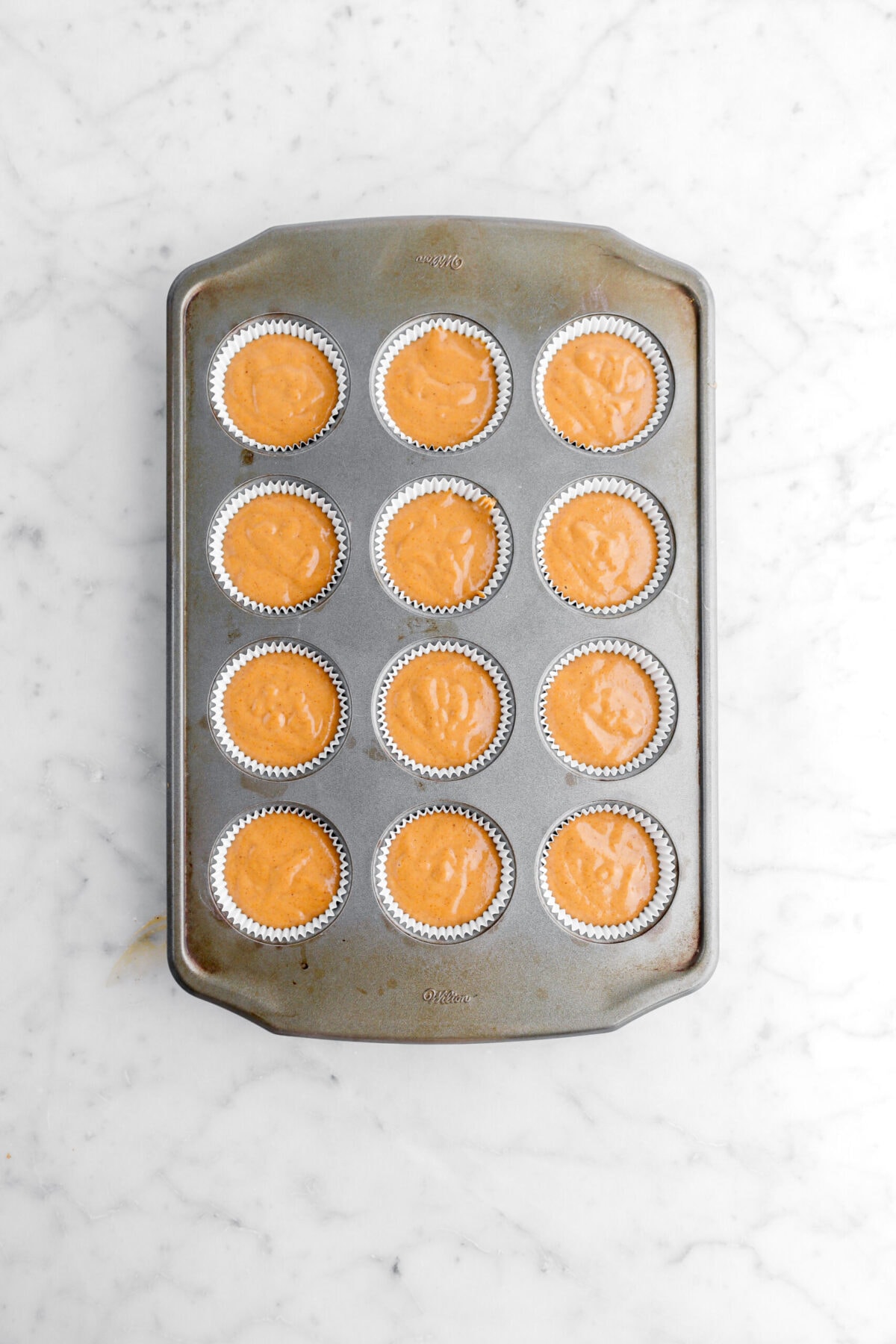 cupcake batter in muffin pan.