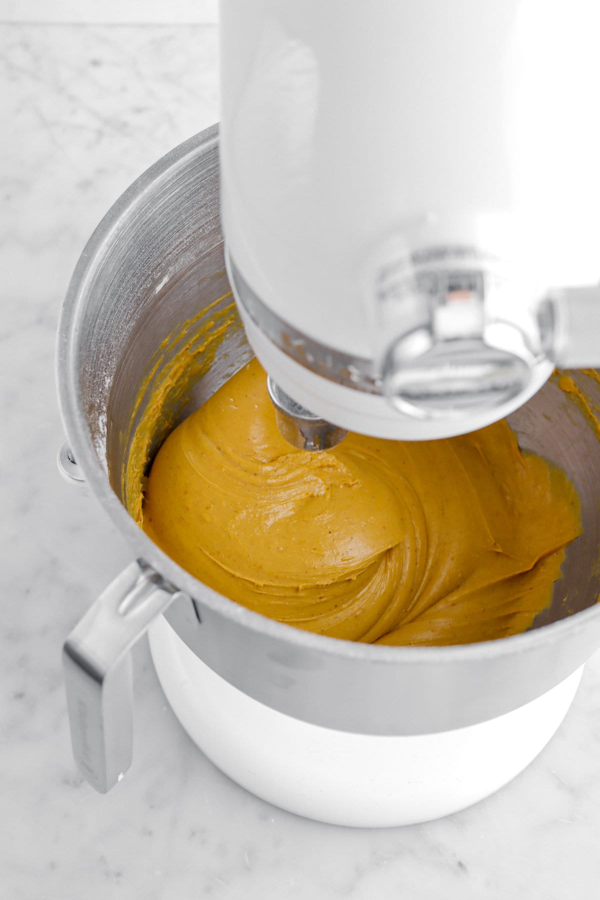 smooth and glossy pumpkin dough in stand mixer.