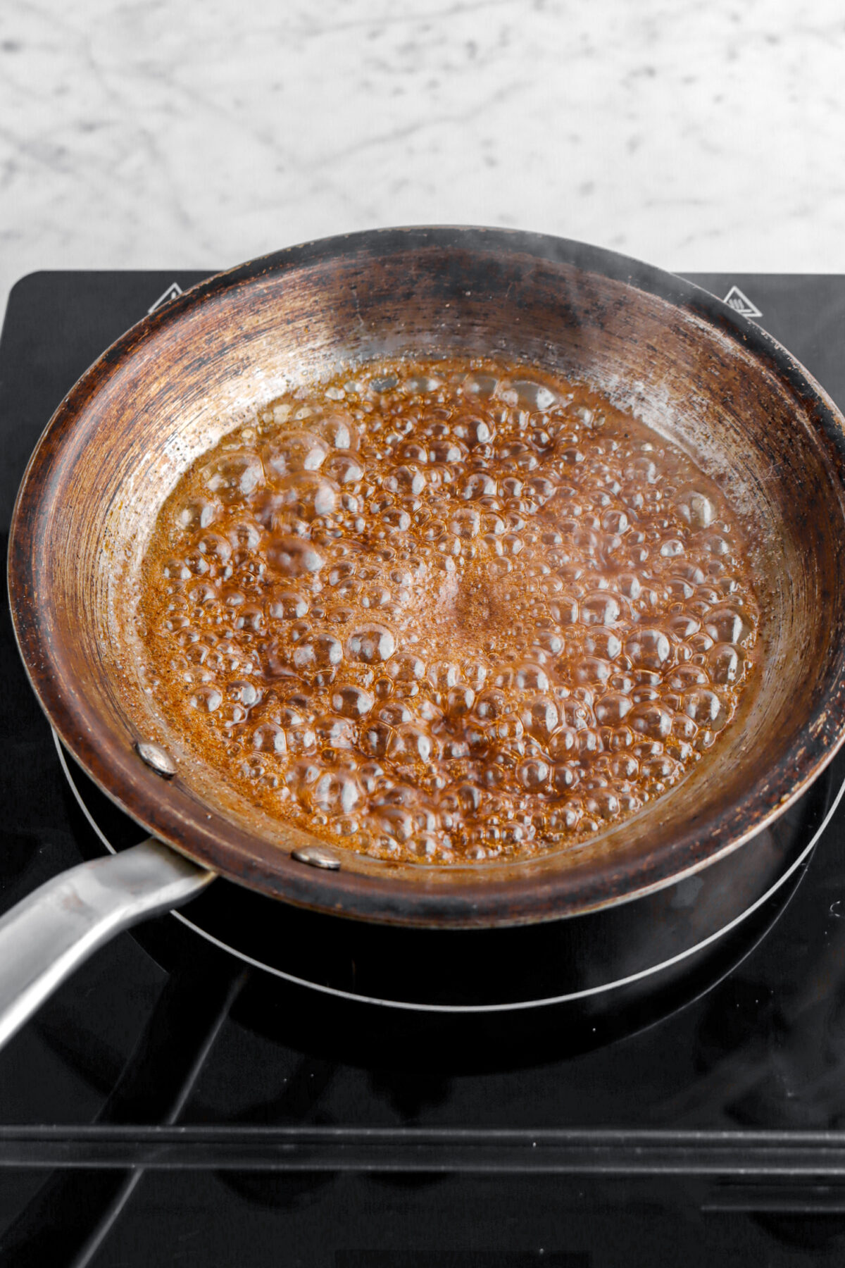 boiling sugar and spice mixture in small skillet.