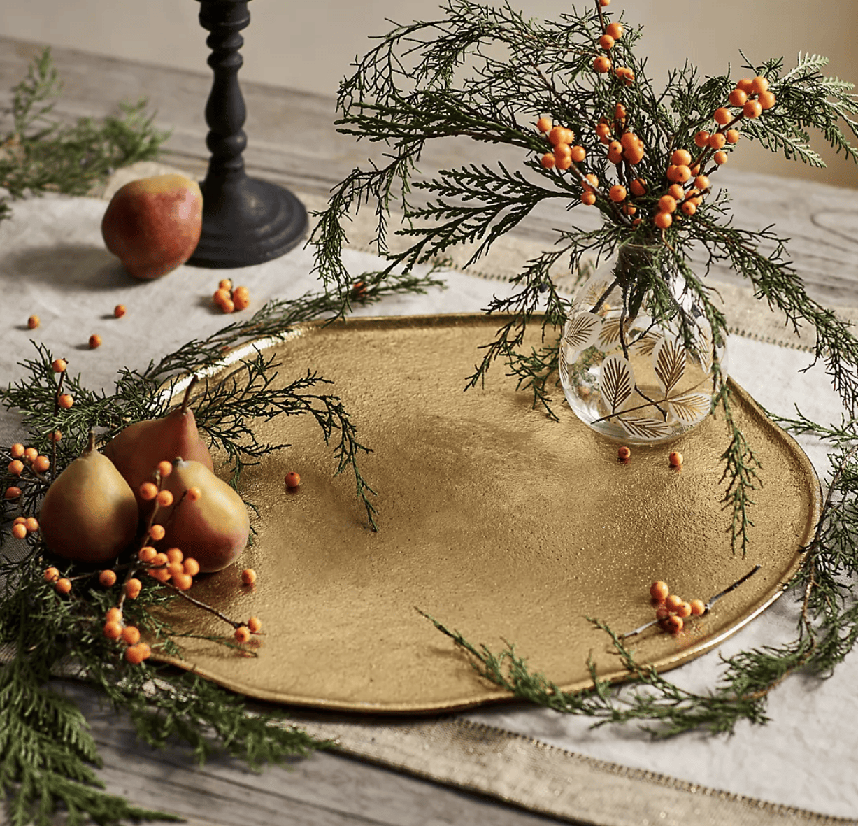 gold serving platter with greenery.
