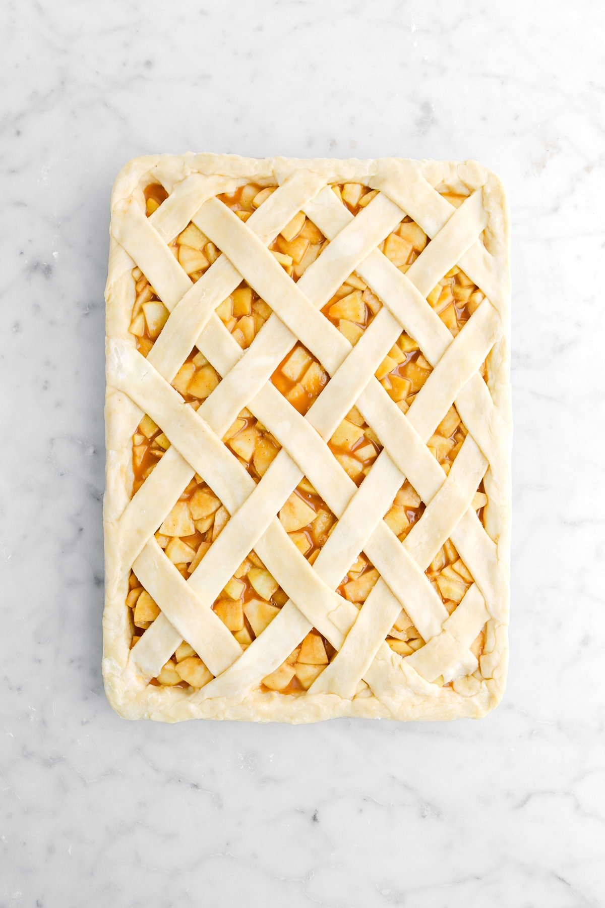 sealed lattice top on apple slab pie.