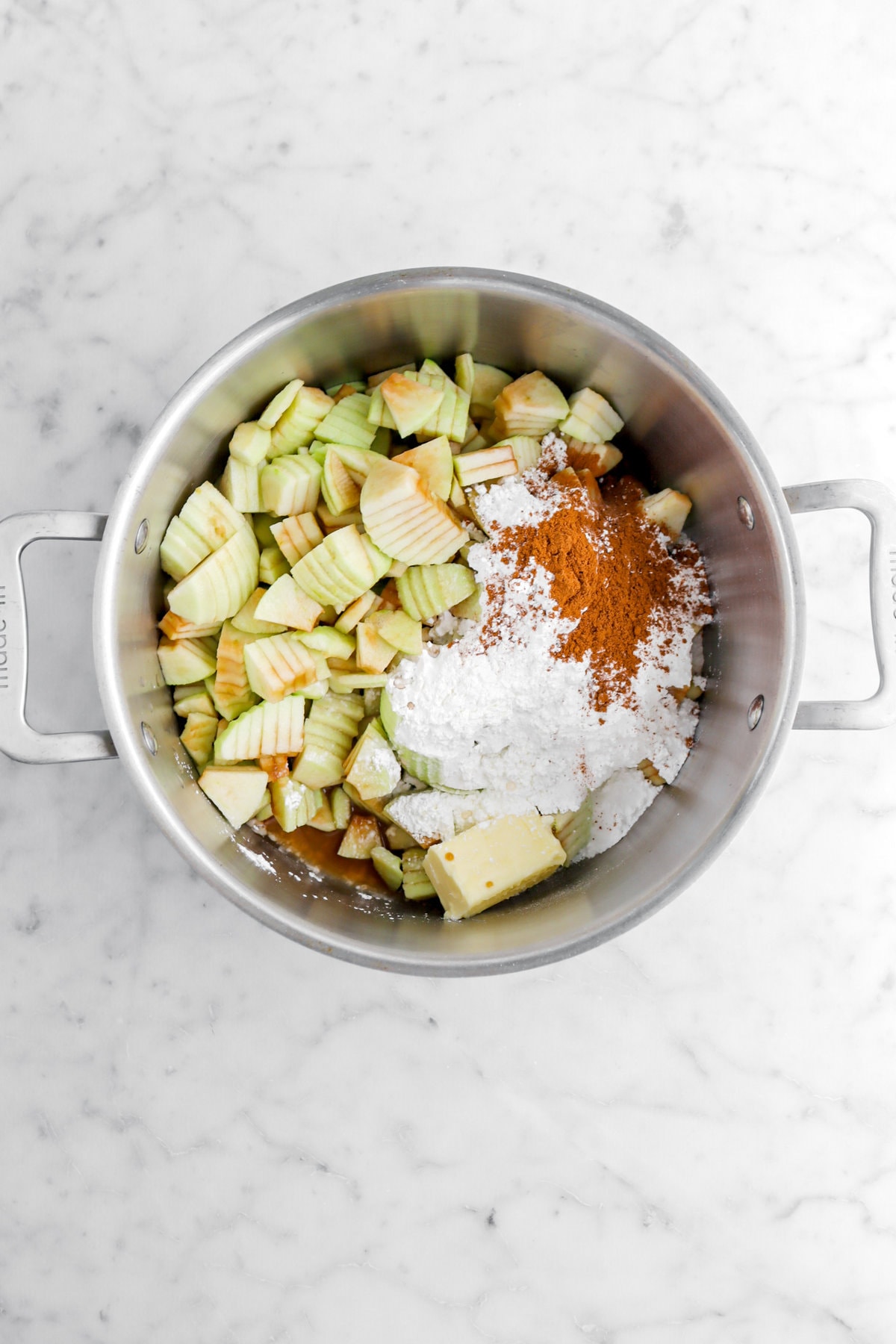 ingredients for apple pie filling in large pot.