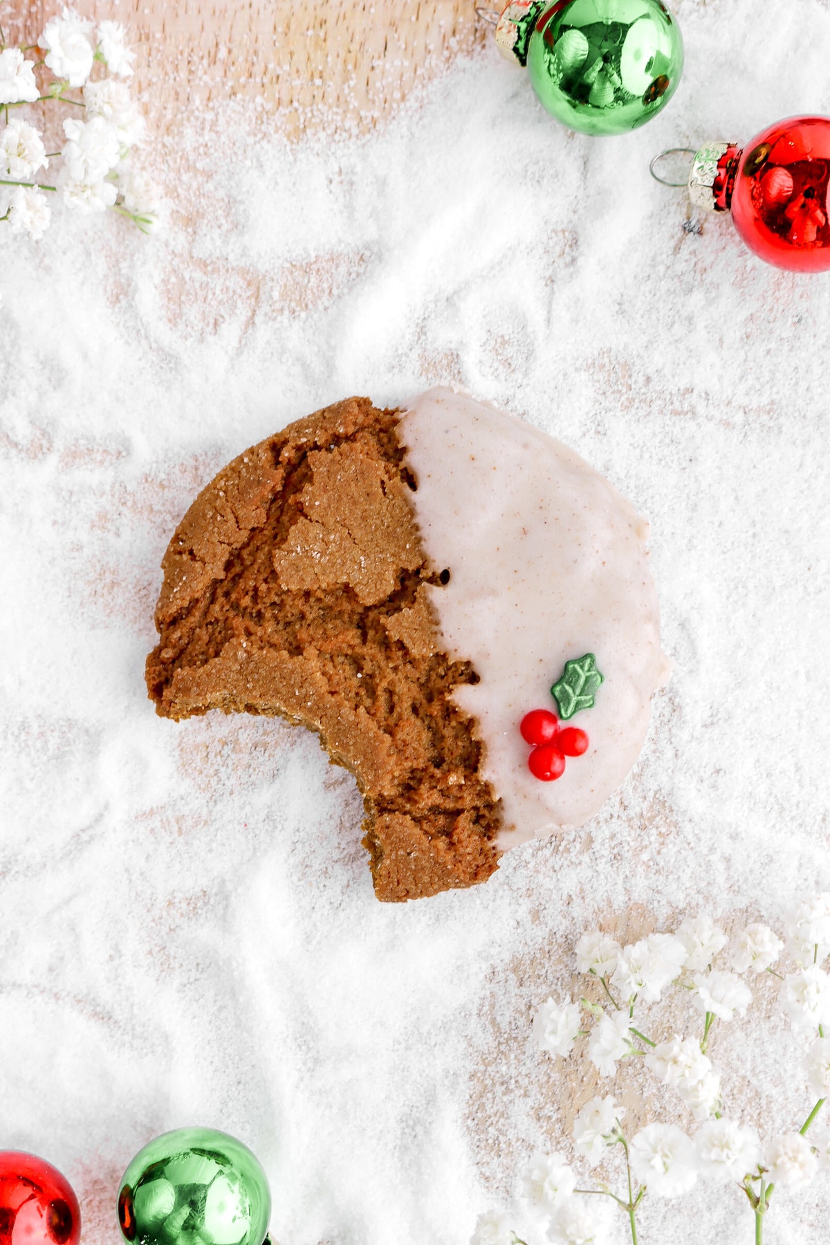 overhead image of gingerbread molasses cookie on granulated sugar on wood board.