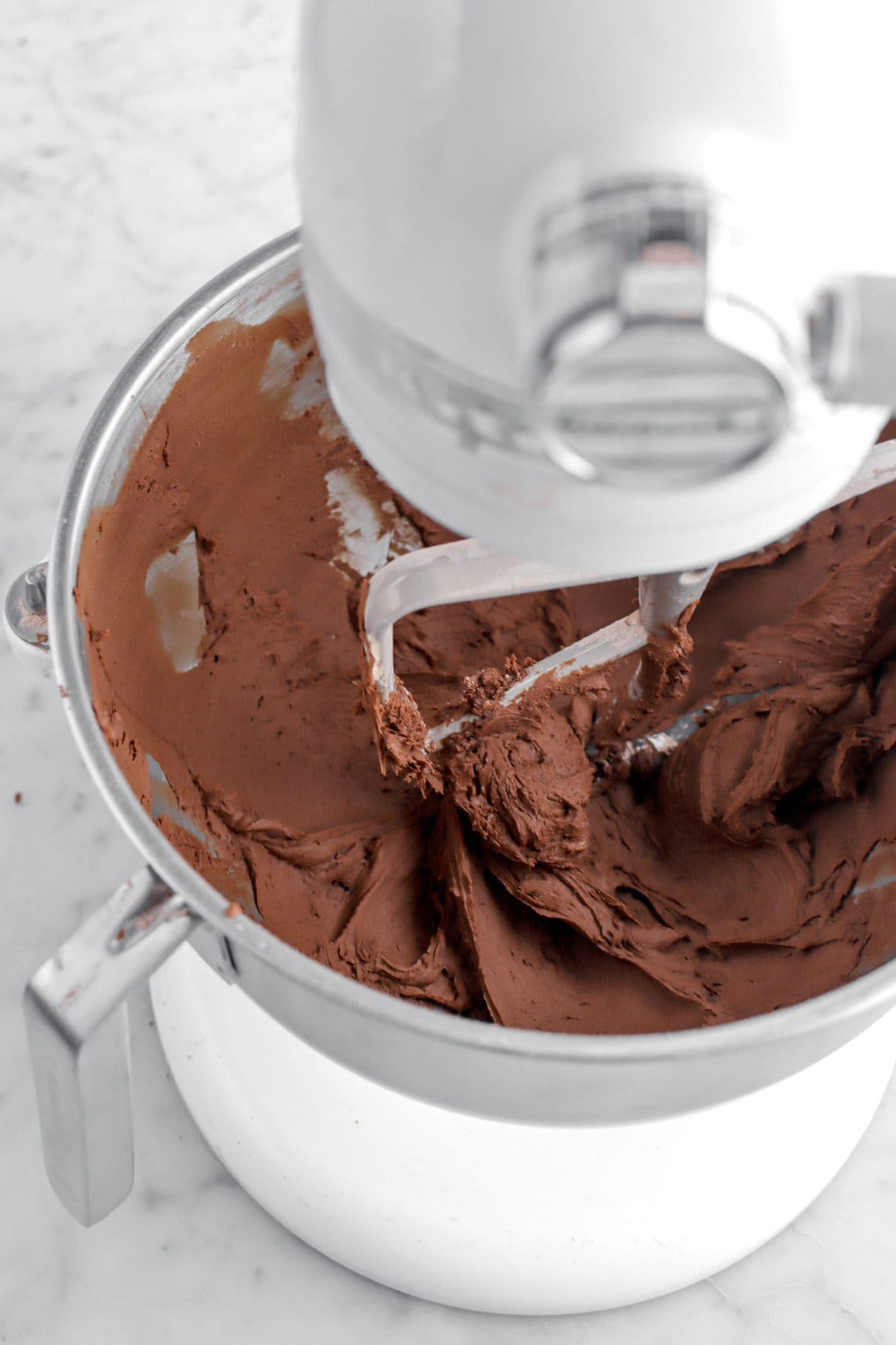 thick chocolate buttercream in stand mixer.