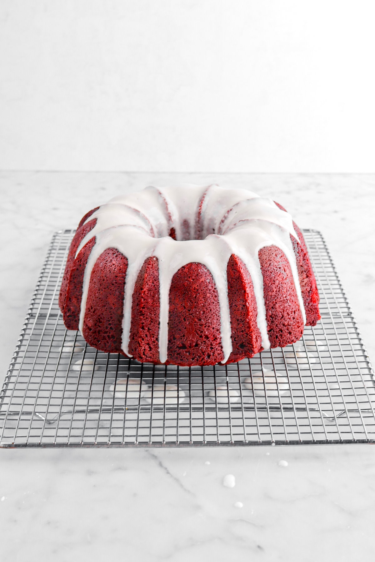 cream cheese icing added on top of red velvet cake.