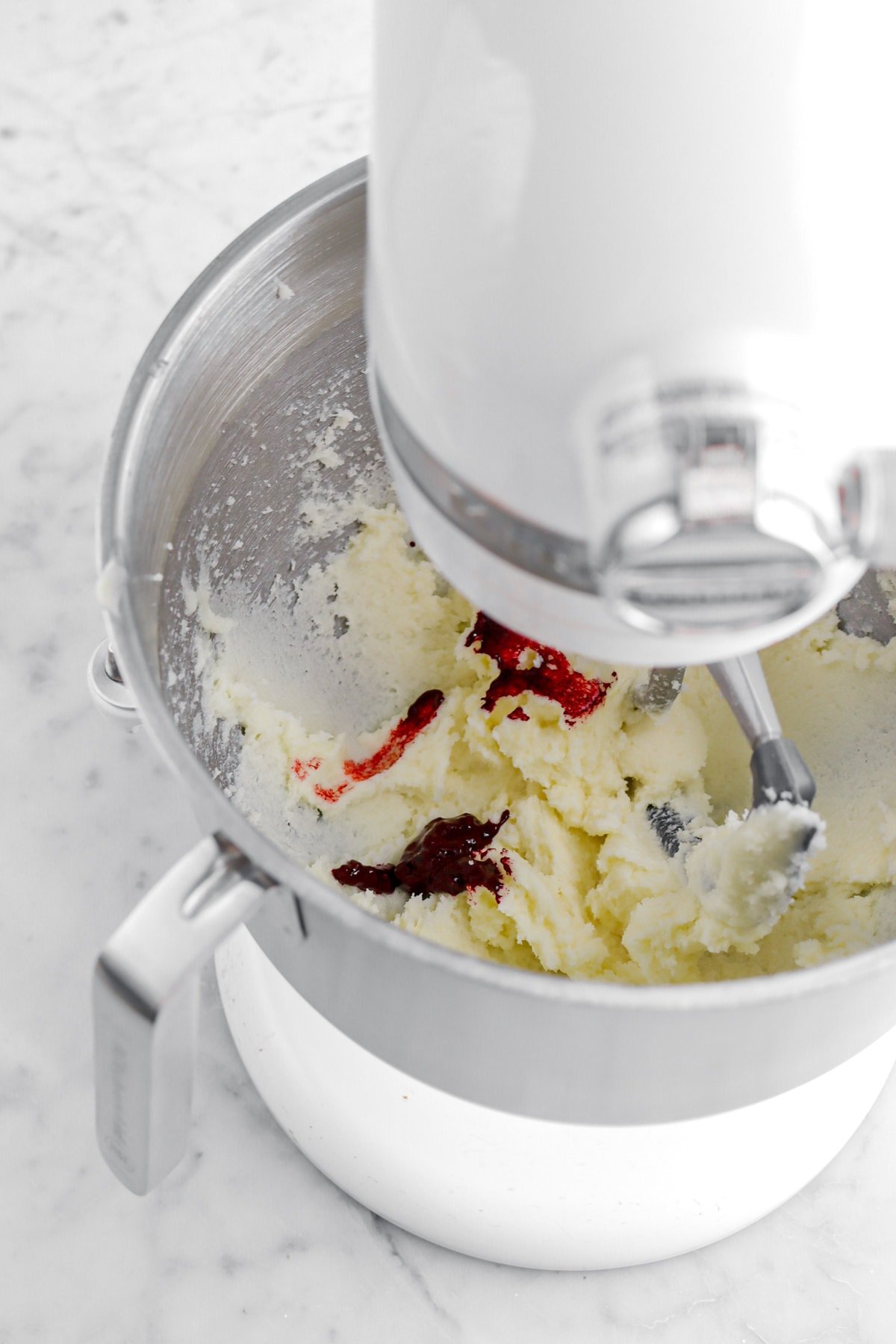 red food dye added to butter and sugar in stand mixer.