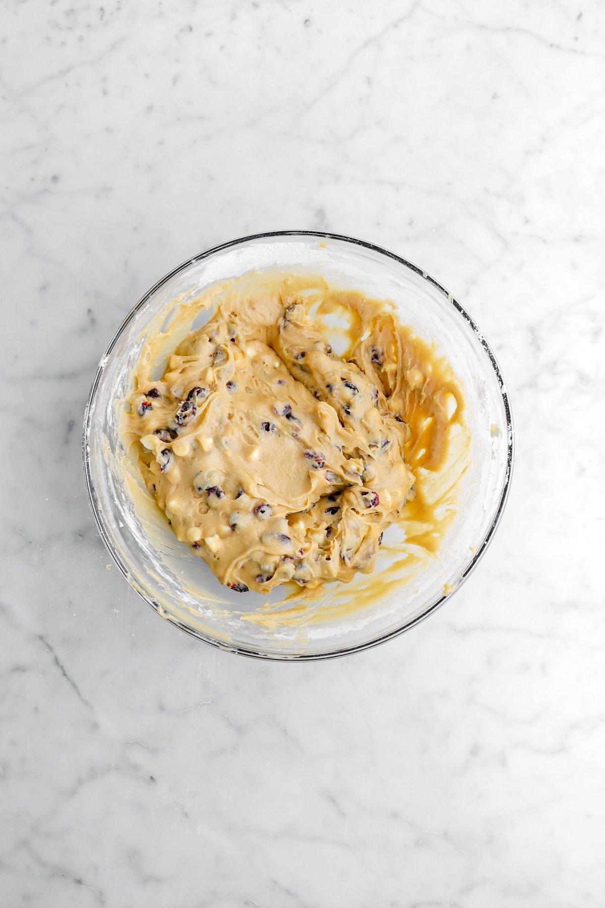 white chocolate cranberry blondie batter in glass bowl.