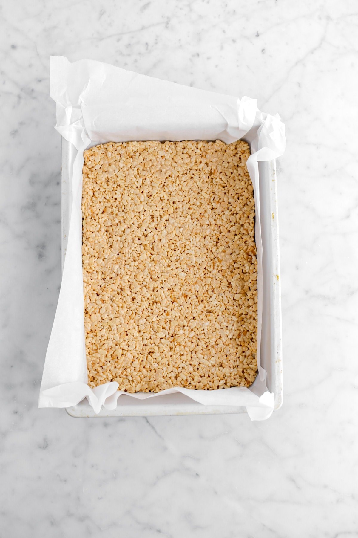 pressed rice cereal in lined cake pan.