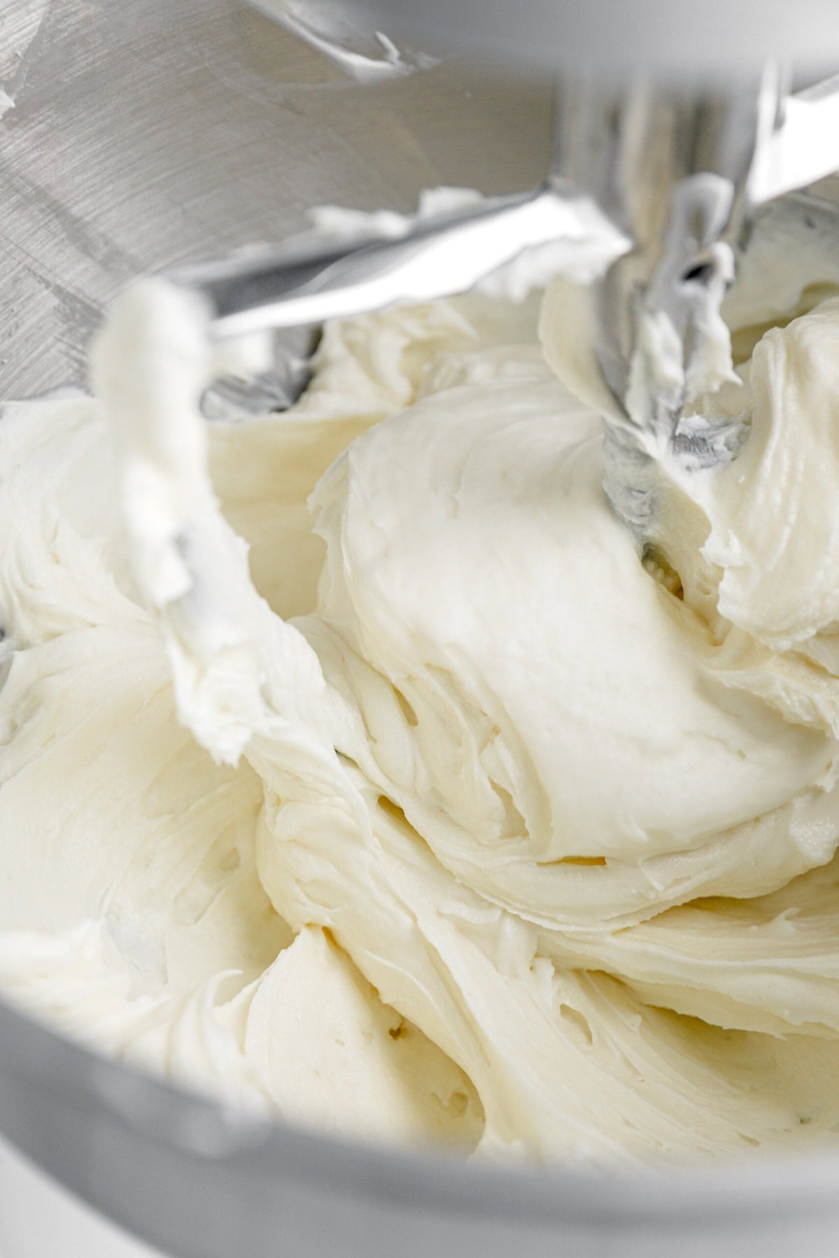 smooth cream cheese in mixer.