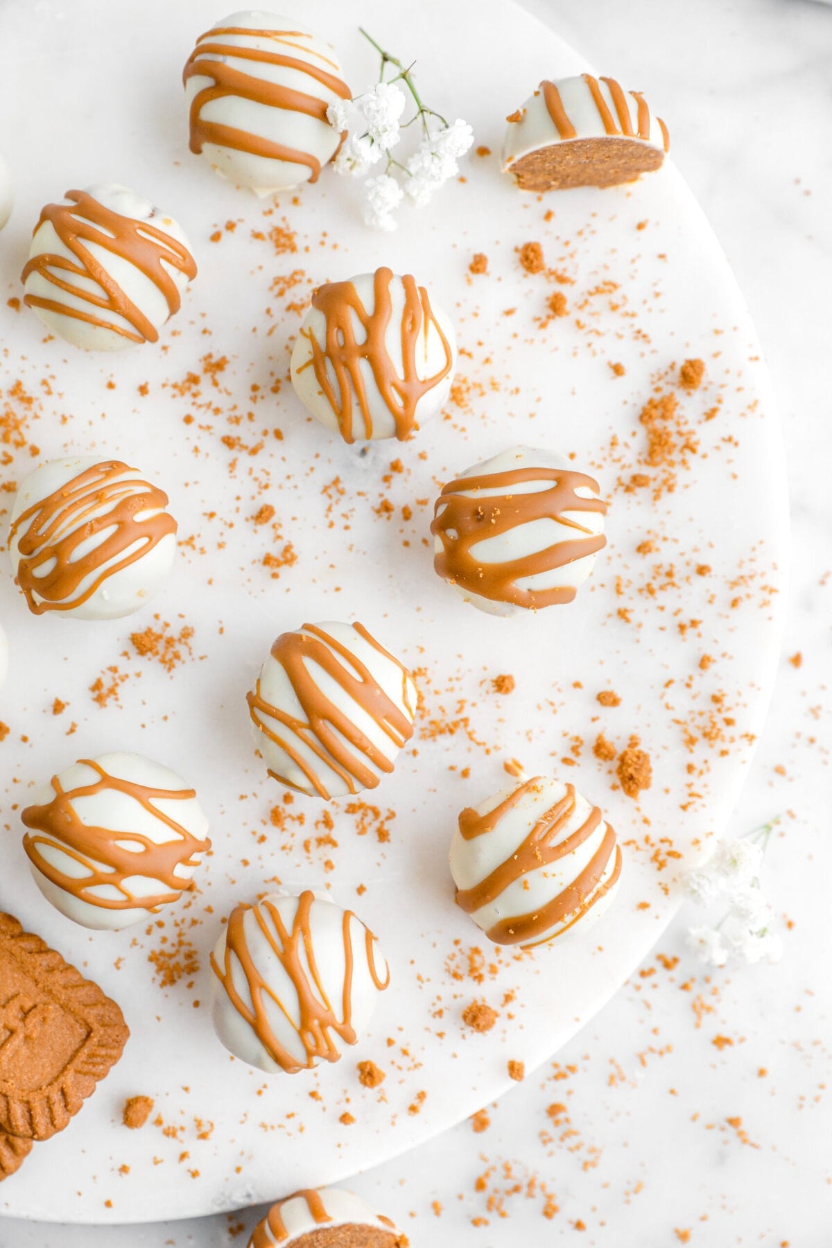 overhead image of biscoff truffles on marble surface.